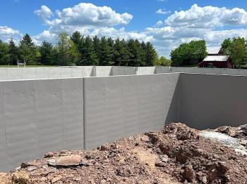 Foundation wall with gray Deco 20 Seal Waterproofing Membrane