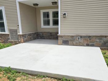 concrete slab by a house side door